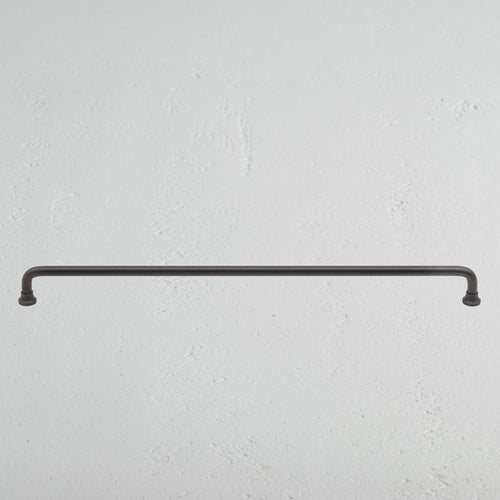 Large bronze Sycamore furniture handle with a sleek, modern design against a neutral background.