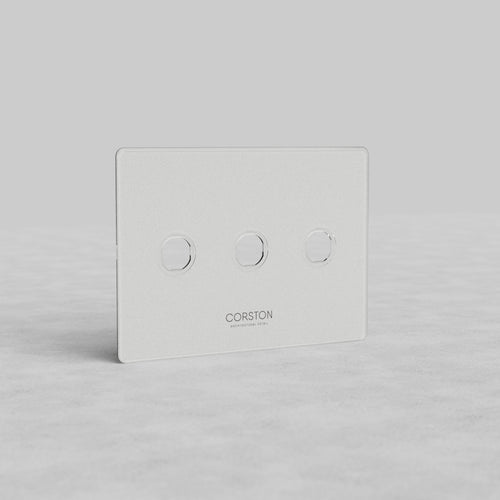Clear 3G Switch Plate Kew US with three circular switch buttons and CORSTON branding on a flat surface.