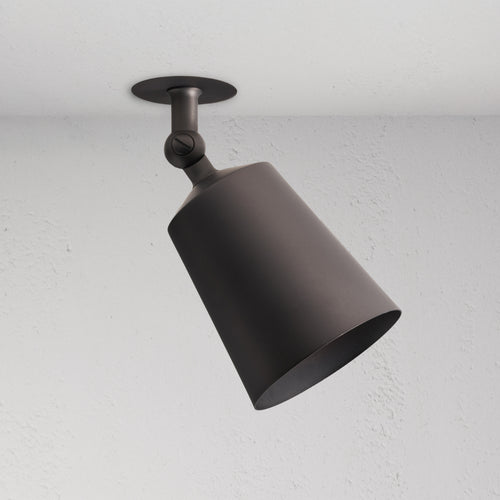 Bronze Perryn Single 70mm Spotlight mounted on white ceiling, angled downward in a modern design.