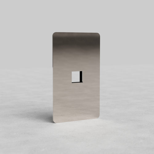 Polished nickel 1G Keystone Plate Kew US with single keystone cutout, displayed on a light surface.