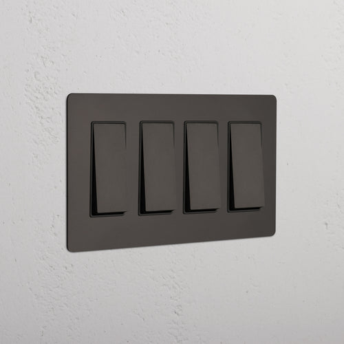 Kew 4G Rocker Switch in bronze black finish, featuring four switches on a rectangular plate.