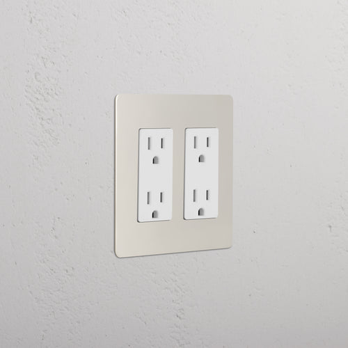 Kew 2G Outlet in Polished Nickel White finish, double socket, mounted on a white wall.