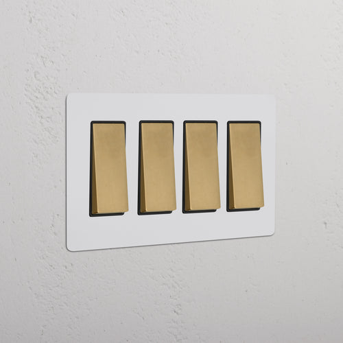 Kew 4G Rocker Switch in paintable antique brass black finish with four black rocker switches in a row.