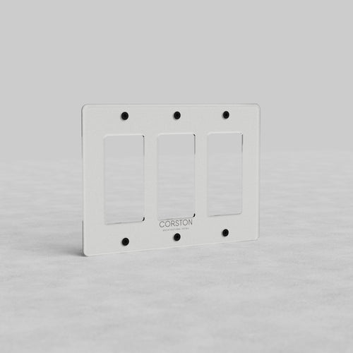 Clear triple outlet plate, 3G Outlet Plate Kew US, rectangular with beveled edges and six screw holes.