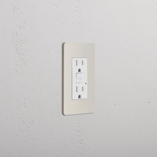 Grove 1G 15A GFCI Outlet in Polished Nickel White with two sockets and GFCI test/reset buttons on a wall.