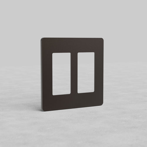 Bronze 2-gang outlet plate, Grove US style, with two rectangular cutouts, shown upright on a light surface.