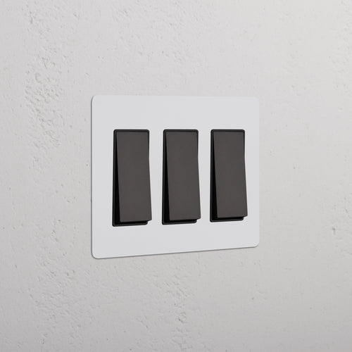 Kew 3G Rocker Switch in Paintable Bronze Black finish, shown on a white wall plate.