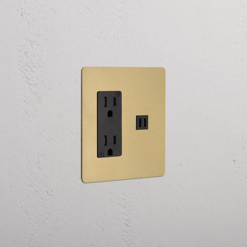 Kew 2G outlet and fast charge USB socket in antique brass black finish, shown on a white wall.