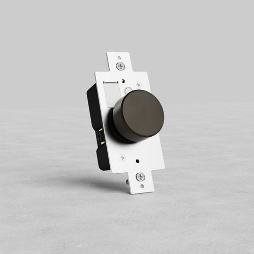 Bronze dimmer switch with a metallic finish, round dark knob, and rectangular mounting plate on gray background.
