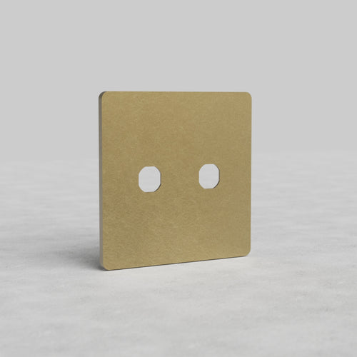 2G Switch Plate Grove US in Antique Brass finish, featuring two switch apertures, on a light surface.