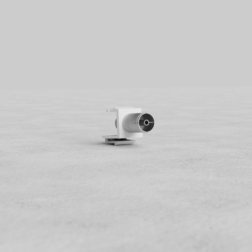 White TV Keystone Module with a black circular TV connector on the front, shown on a plain surface.