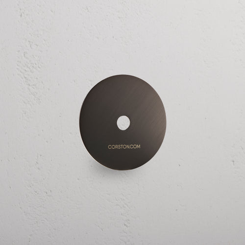 Bronze Sample Finish disc with 'Bronze' and 'CORSTONCOM' text, displayed on a white textured surface.