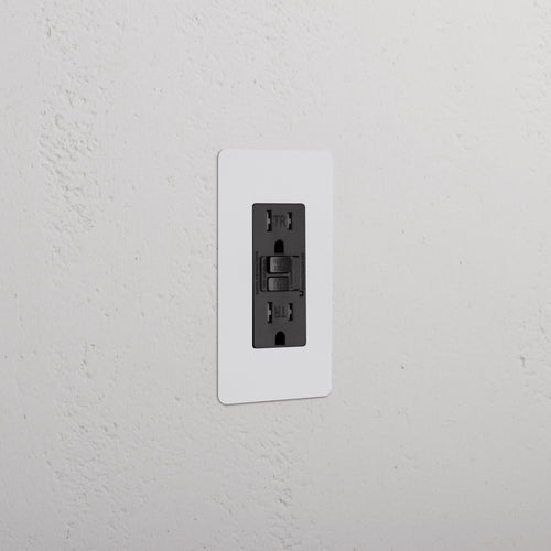 Kew 1G 15A GFCI Outlet in paintable black with white faceplate, two sockets, and reset/test buttons.