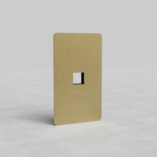 Antique brass 1G Keystone Plate Kew US with single keystone cutout and rounded corners on light background.