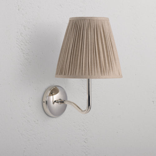 Large Malvern Wall Light in natural beige with polished nickel base and pleated fabric shade on wall.