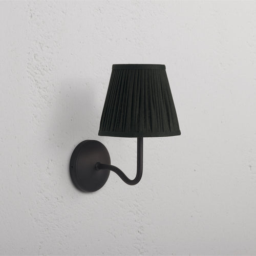 Malvern Medium Wall Light in deep green with bronze fittings, featuring a curved arm and dome-shaped shade.