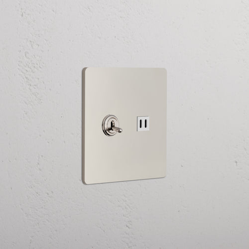 Grove 2G Toggle Switch & Fast Charge USB in polished nickel white, mounted on a light textured wall.