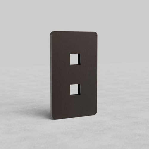 Bronze 1-gang faceplate with two keystone openings for Grove US, shown upright on a gray background.