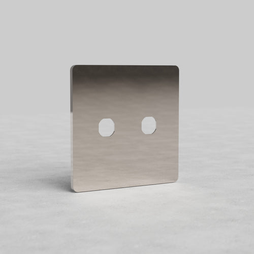 Polished Nickel '2G Switch Plate Grove US' with two switch apertures, shown upright on a light surface.