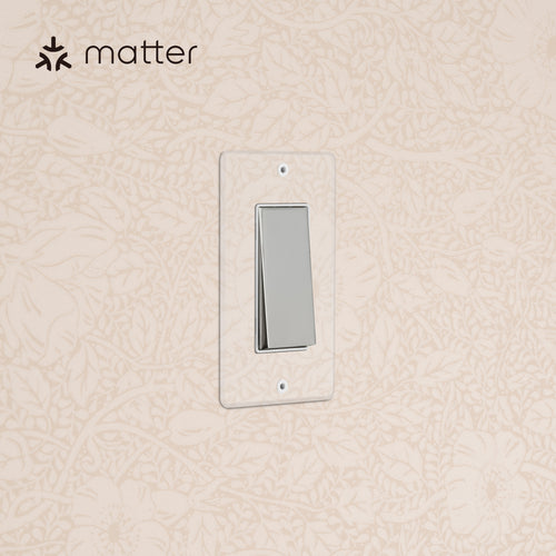 Kew 1G Smart Retractive Rocker Switch in clear polished nickel white, mounted on a wall.