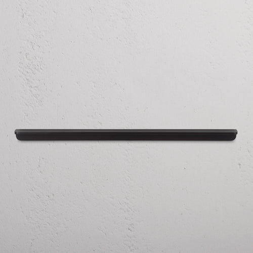 Large bronze Oxford Furniture Handle mounted horizontally on a white wall, suitable for cabinets or drawers.