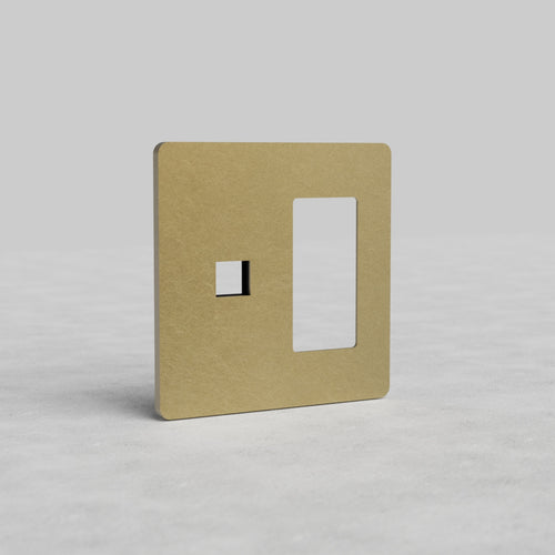 Antique brass 2G outlet and keystone wall plate Grove US with two cutouts on a light background.