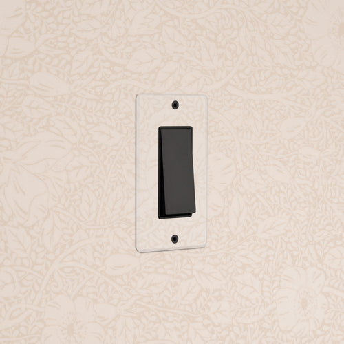 Kew 1G Rocker Switch – Clear bronze black finish, single black rocker on a square plate, wall-mounted.