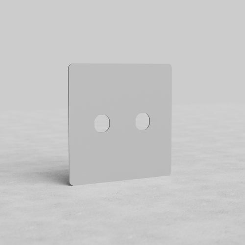 2G Switch Plate Kew US with two central apertures, paintable finish, shown upright on light background.