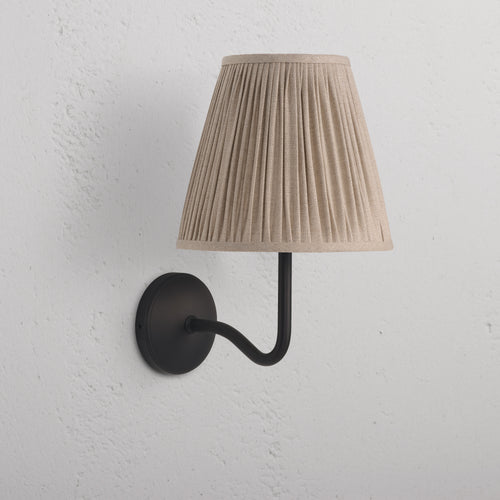Large Malvern Wall Light in natural beige with a pleated fabric shade and bronze wall-mounted arm and base.