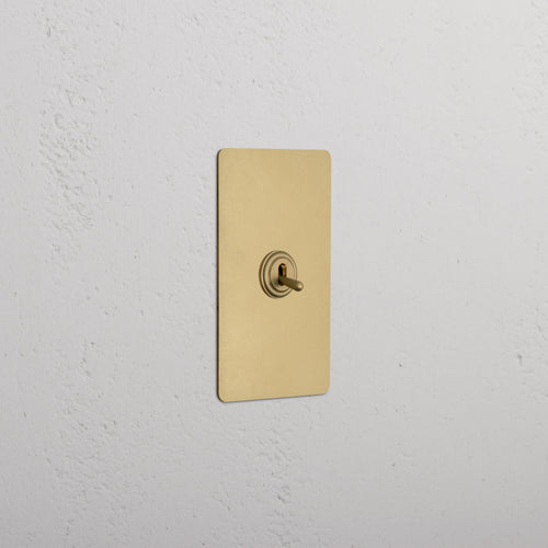 Kew 1G Four Way Toggle Switch in antique brass with rectangular plate and four toggle levers.