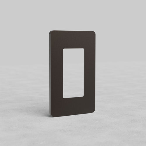 Bronze 1G Outlet Plate Grove US with a central cut-out, displayed upright on a light gray surface.