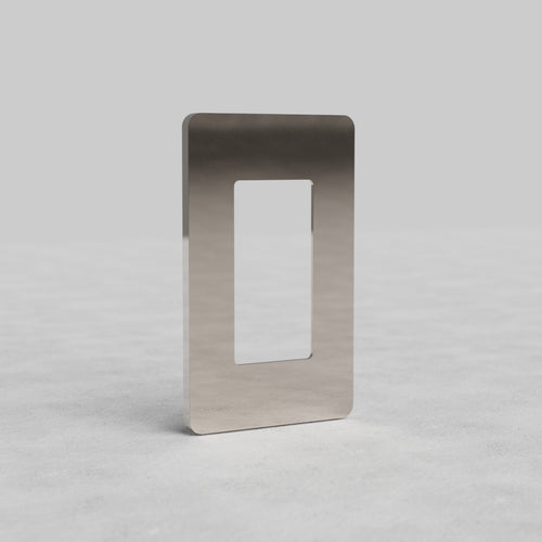1G Outlet Plate Grove US in polished nickel with a central rectangular cutout, shown on a light surface.