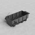 4G US New Work Electrical Box made of black plastic with metal screws, shown on a light grey surface.