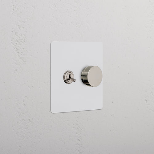 Kew 2G Toggle & Dimmer Switch in paintable polished nickel with toggle and round dimmer knob on plate.