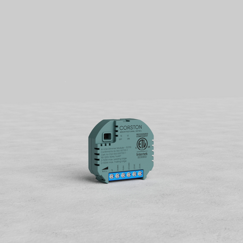 Gray Corston In-Line Dimmer Module US with blue terminal block, shown on a light gray surface.