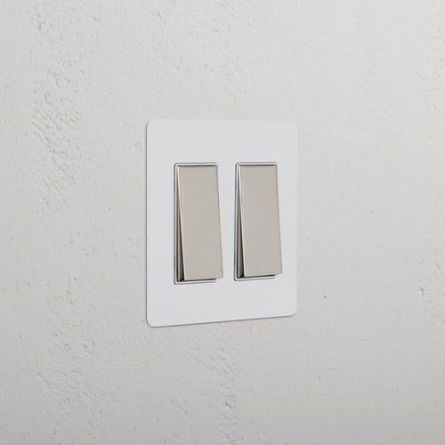 Kew 2G Rocker Switch in paintable polished nickel white finish, featuring two rectangular rocker switches.