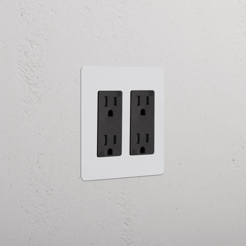 Kew 2G Outlet - Paintable Black double socket with a sleek, paintable black finish on a wall.