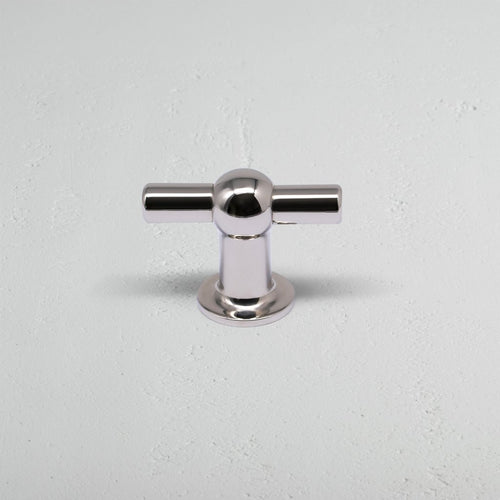 Harper T-Bar Furniture Handle Medium in polished nickel, T-shaped with round base, on light gray surface.