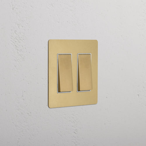 Kew 2G Rocker Switch in antique brass with white inserts, featuring two rocker switches.