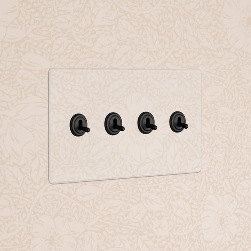 Kew 4G Toggle Switch - Clear Bronze with four black toggles on a clear bronze panel.