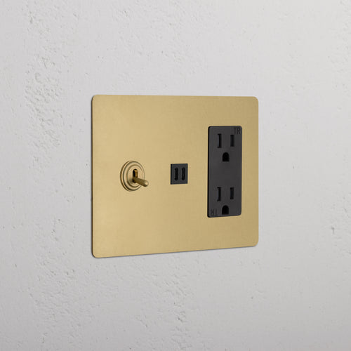 Kew 3G Toggle Switch, Outlet, and Fast Charge USB in Antique Brass Black finish on a white wall.