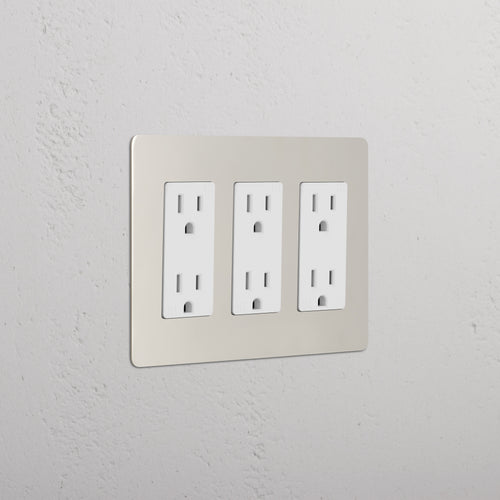 Kew 3G Outlet in polished nickel white finish, triple electrical socket plate on a light wall.