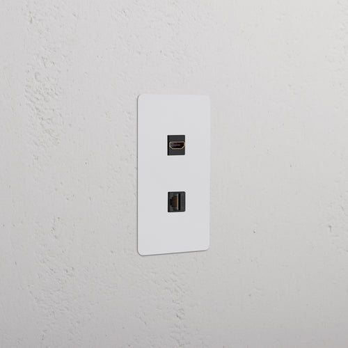 Kew 1G HDMI & CAT 6 Keystone, paintable black faceplate with two ports, installed on a wall.