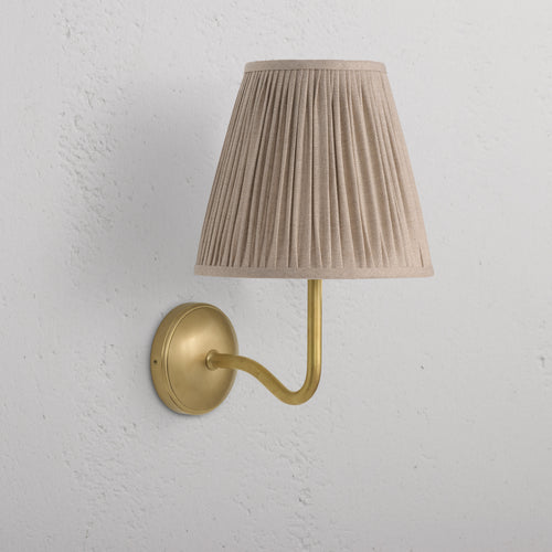 Large Malvern Wall Light in natural beige with an antique brass base and pleated fabric shade, wall-mounted.