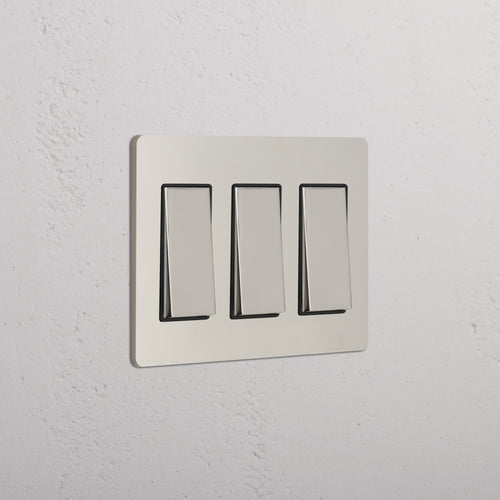 Grove 3G Rocker Switch in polished nickel black finish, mounted on a white textured wall.