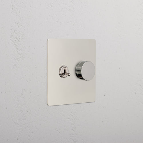 Kew 2G Toggle & Dimmer Switch in polished nickel with toggle lever and round dimmer knob on square plate.