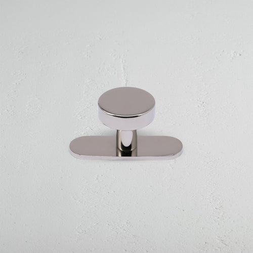 Kilburn Furniture Knob in polished nickel finish, featuring a round, smooth top and simple metal base.