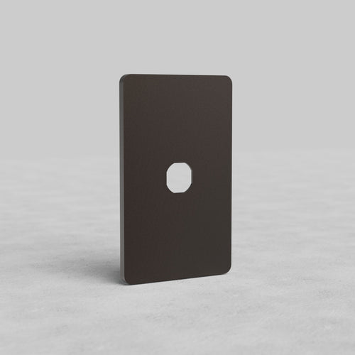 Bronze 1G Switch Plate Grove US with central cutout, shown upright on a light, textured surface.