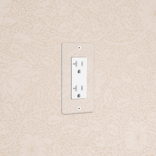Kew 1G 20A Outlet in Clear White finish, single socket, mounted on beige floral-patterned wall.
