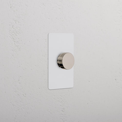 Kew 1G Dimmer Switch in paintable polished nickel finish, with a round knob and rectangular plate.